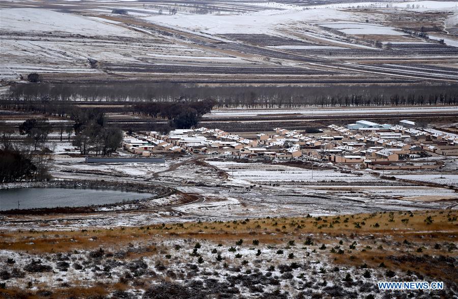 Scenery of snow-covered village houses and fields in China's Inner Mongolia