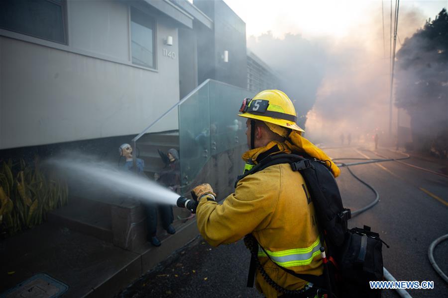 Thousands evacuated in Los Angeles over fast-moving wildfire near Getty Center