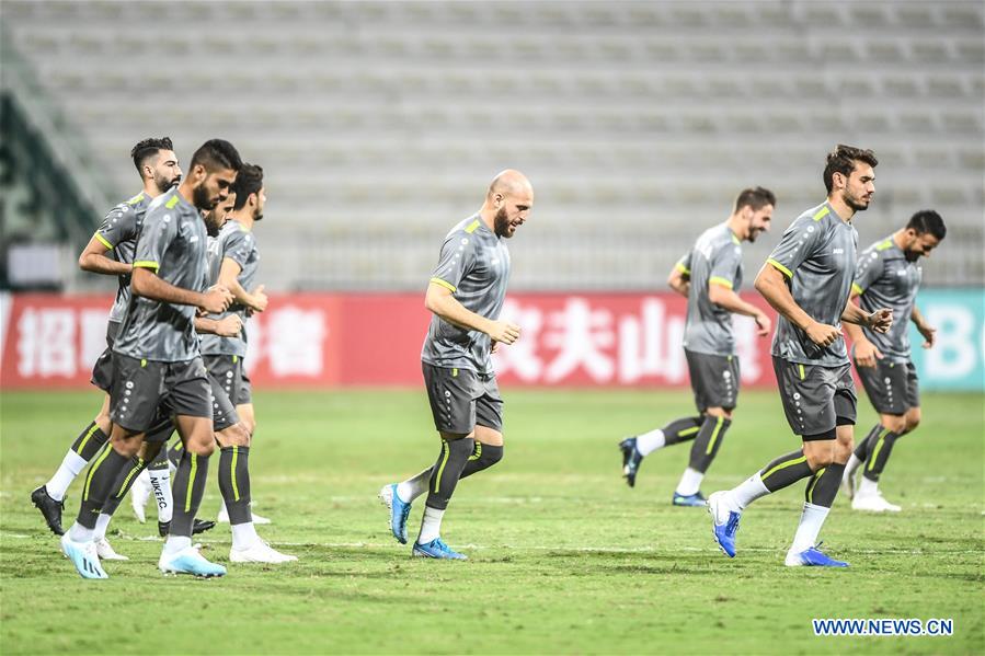 Players of China and Syria attend training sessions before group A match