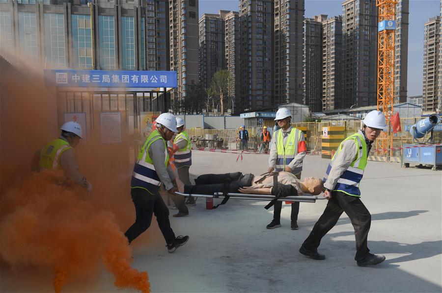 Constructors take part in fire drill in Quanzhou, SE China's Fujian