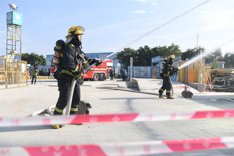 Constructors take part in fire drill in Quanzhou, SE China's Fujian