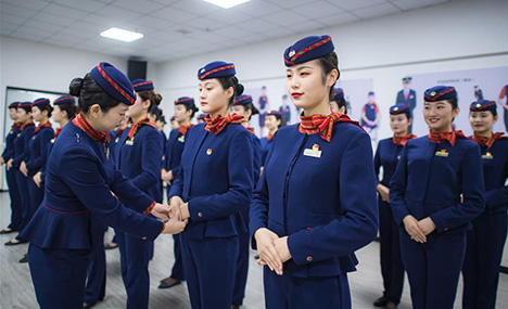 Stewardesses take part in training for Spring Festival travel rush