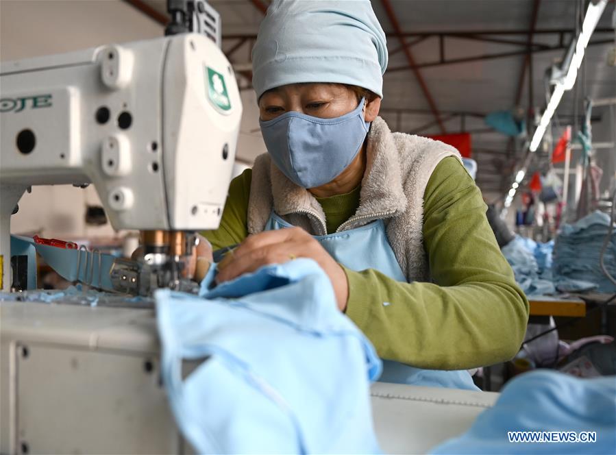 Workers across China make face masks to ensure supply
