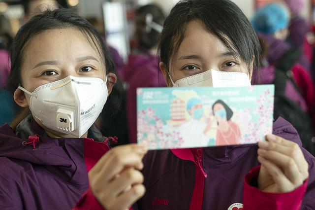 Medical team members leave Wuhan with ‘limited edition’ boarding passes