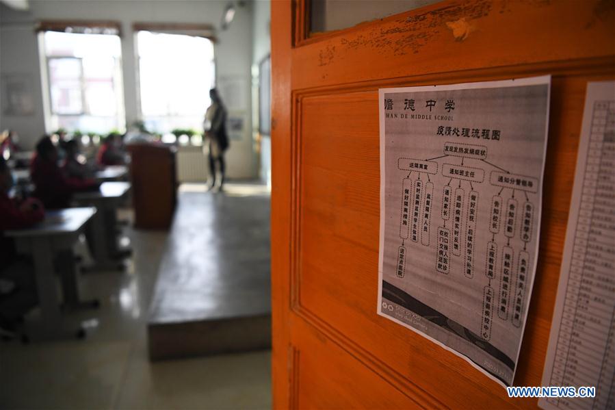 China's Xinjiang reopens all primary, high schools as outbreak wanes