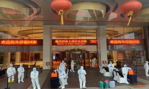 Chinese returning home to quarantine receive warm welcome