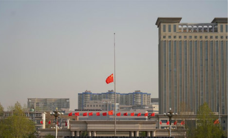 Chinese national flag flies at half-mast to mourn for COVID-19 victims