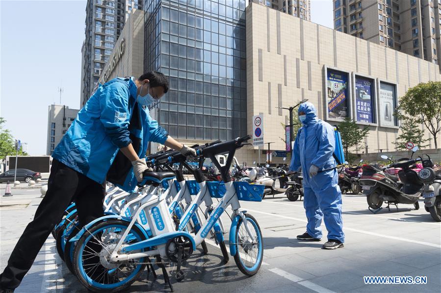 Bicycle-sharing companies restart businesses in Hubei