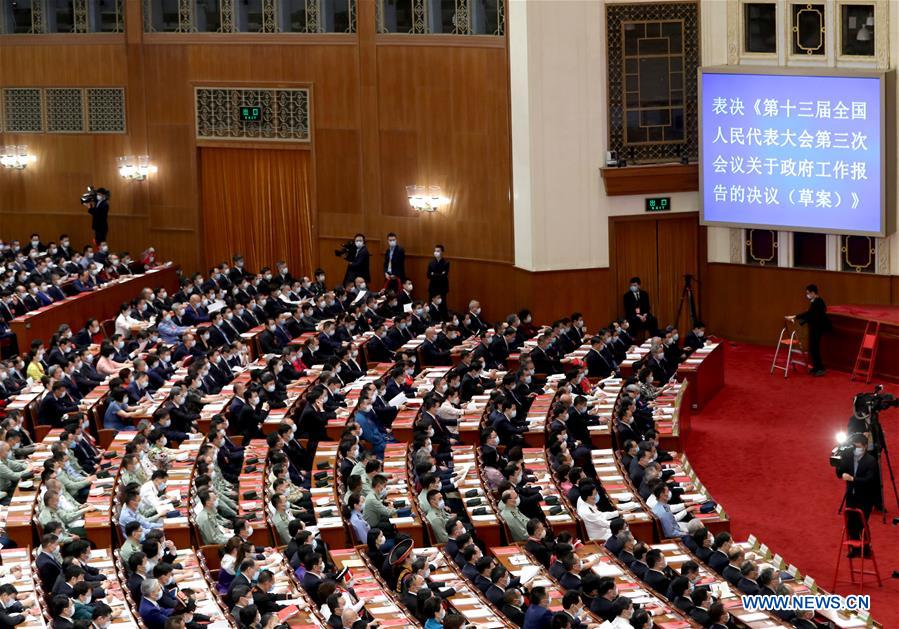 China's top legislature holds closing meeting of annual session