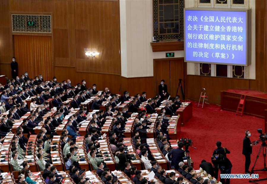 China's top legislature holds closing meeting of annual session