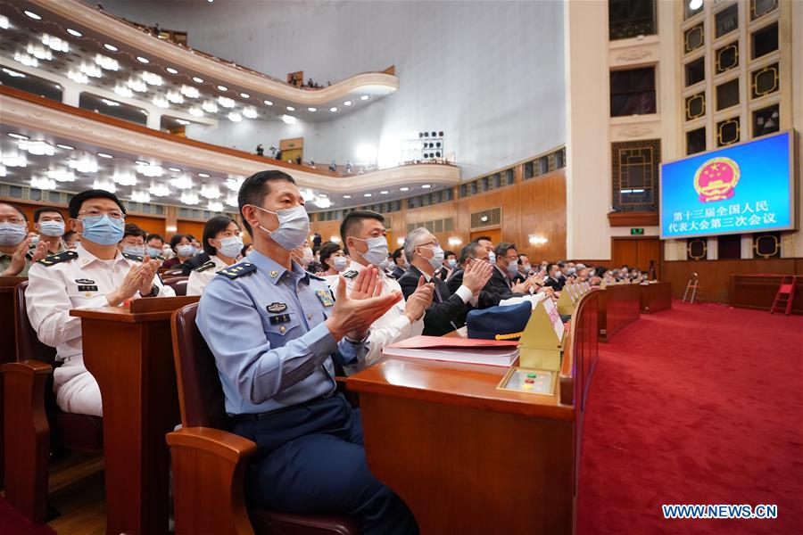 China's top legislature holds closing meeting of annual session
