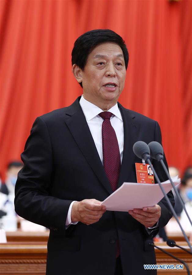 China's top legislature holds closing meeting of annual session