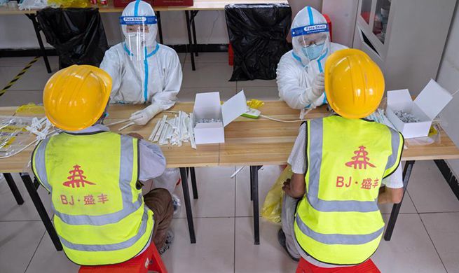 Construction workers receive nucleic acid tests in Beijing