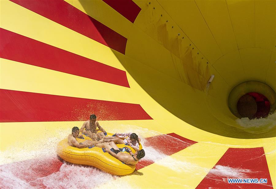 Tourists have fun at Playa Maya Water Park in Wuhan