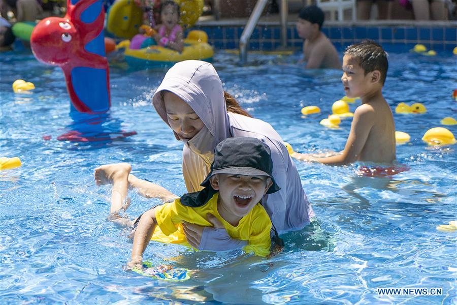 Tourists have fun at Playa Maya Water Park in Wuhan