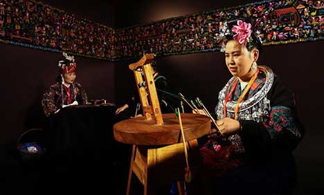 Artisans demonstrate embroidery works of Miao ethnic group