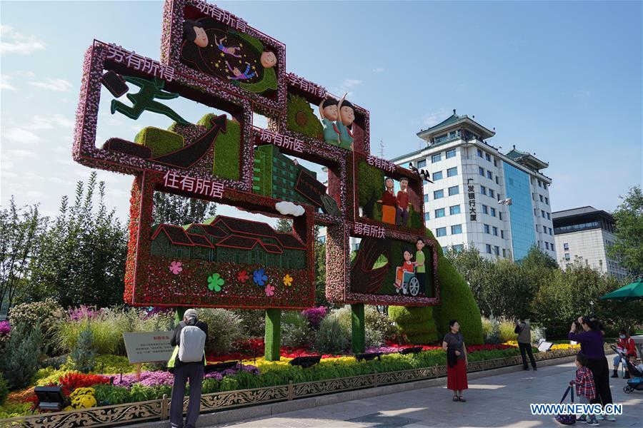 Flower decorations set up along Chang'an Avenue to celebrate Chinese National Day