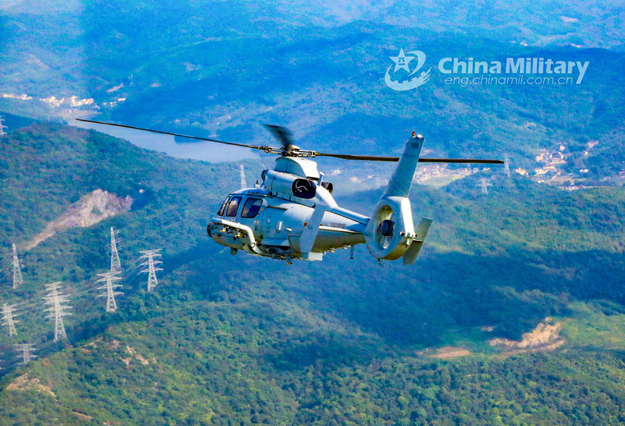 Helicopters patrol over mountainous region