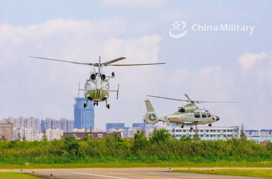 Helicopters patrol over mountainous region