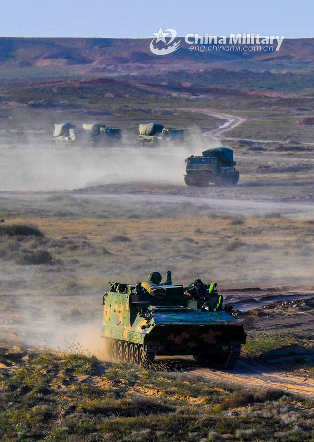 Armored vehicles attached to a combined arms brigade under the PLA 73rd Group Army are en route to a designated training field during a live-fire test on October 7, 2020. (eng.chinamil.com.cn/Photo by Liu Zhiyong)