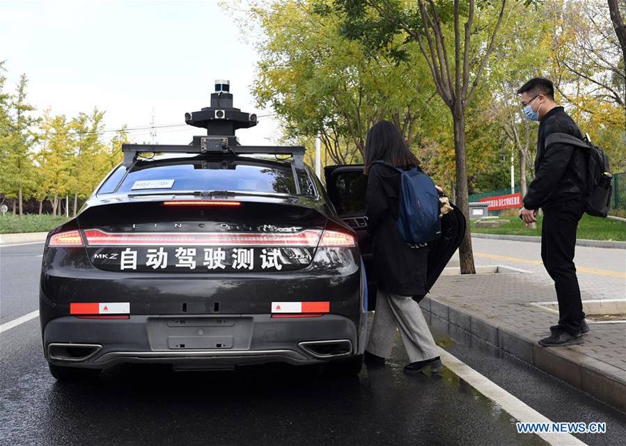 Baidu launches program in Beijing to offer free trials of its self-driving taxi service