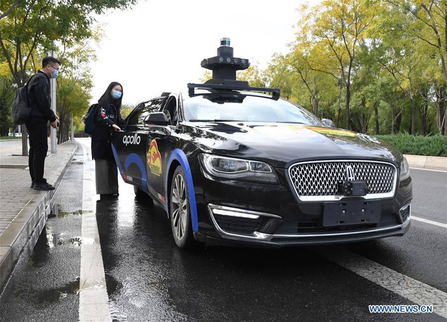Baidu launches program in Beijing to offer free trials of its self-driving taxi service