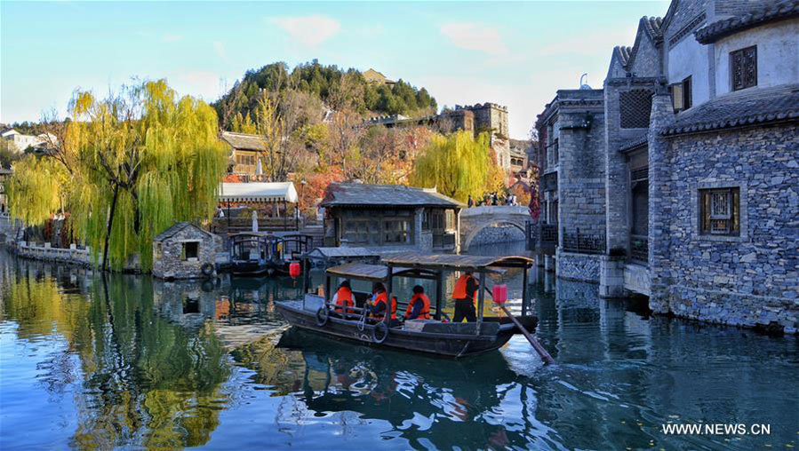 People enjoy autumn scenery in Gubei Water Town in Beijing