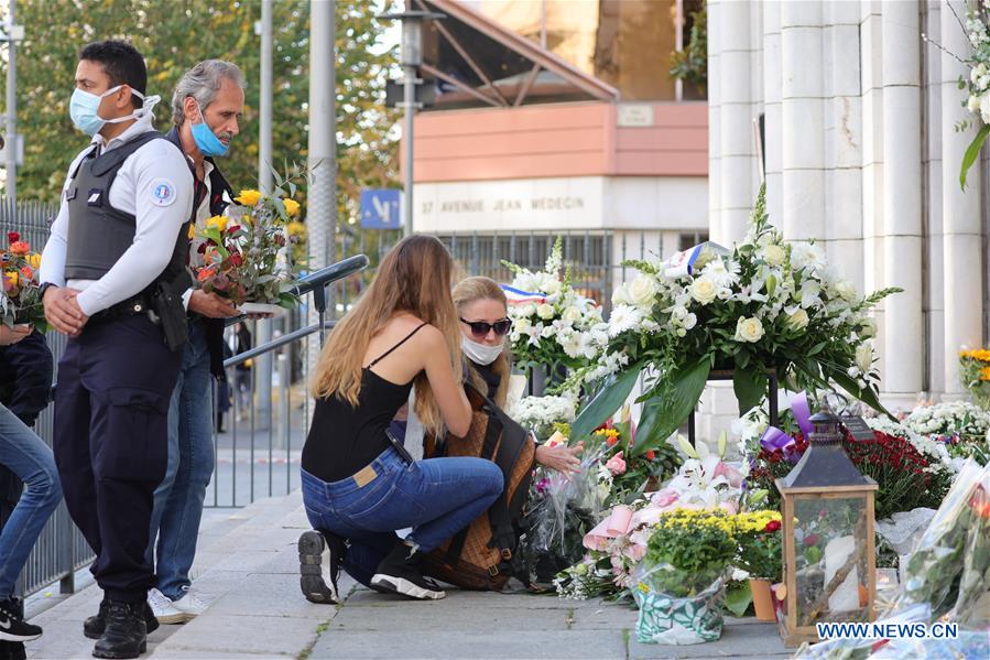 People pay tribute to victims of knife attack in Nice, France