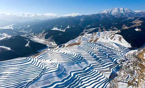 Snow-covered terraced fields in Gansu