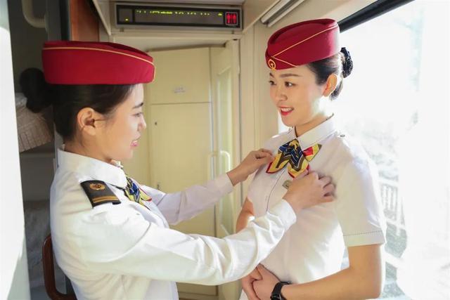 Attendants change uniforms six times as train moves southward