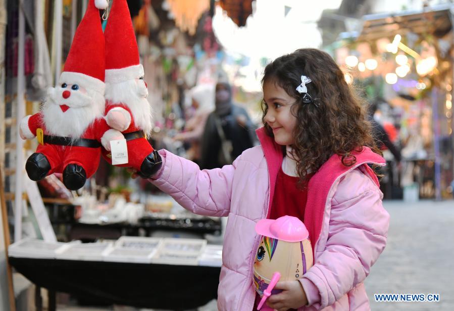 Children with Christmas decorations in Syria