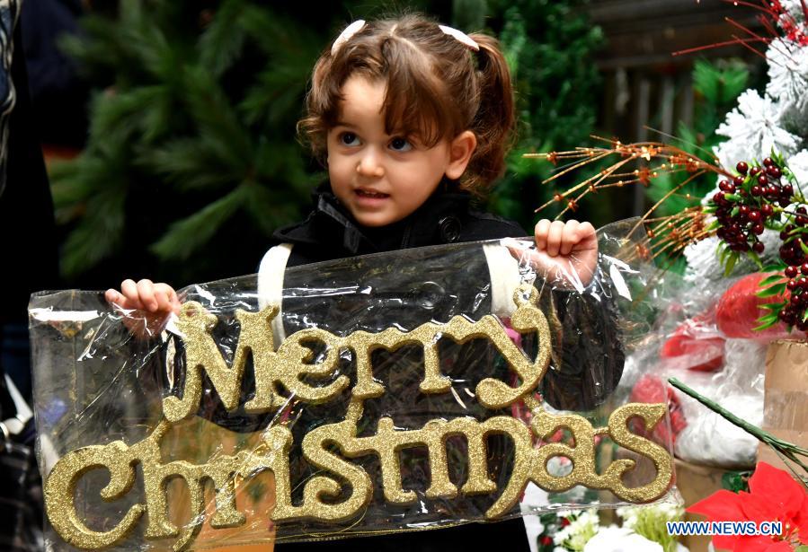 Children with Christmas decorations in Syria