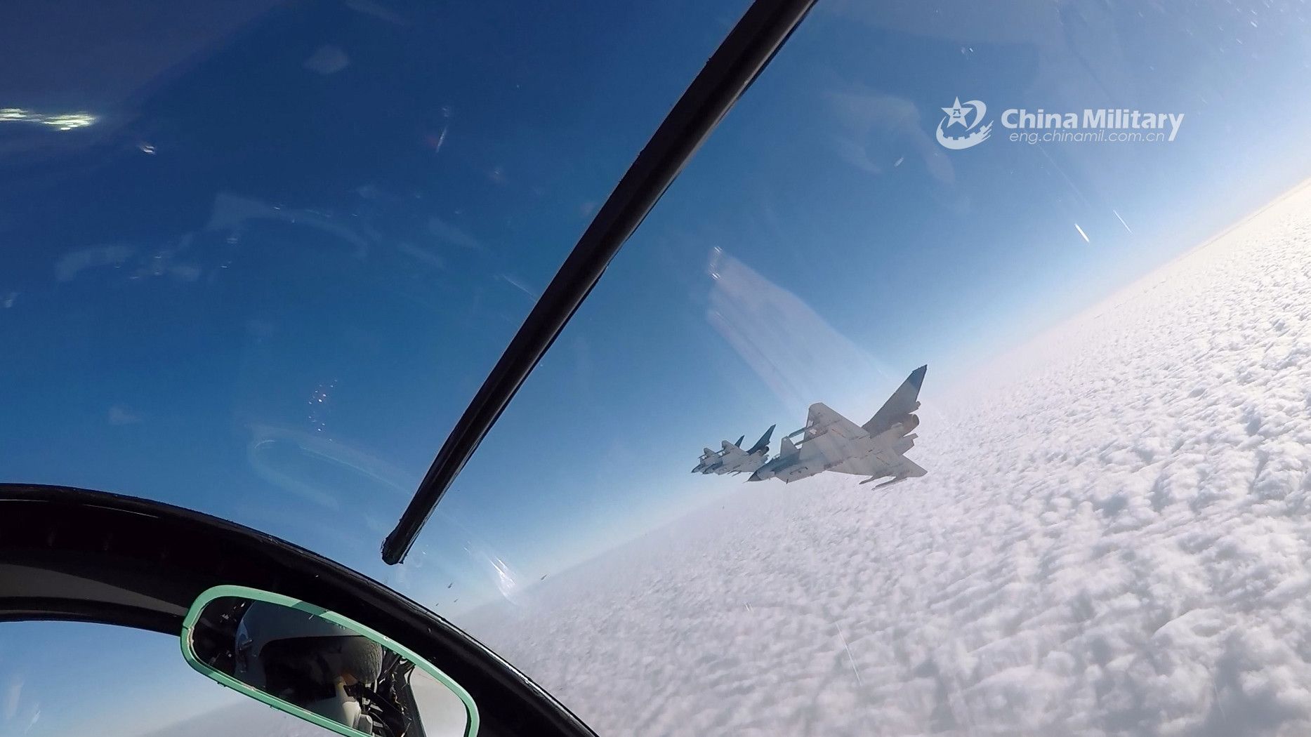 Fighter jets soar to stratosphere above clouds