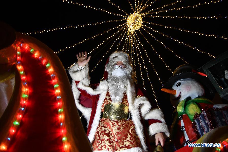 Men dressed in Santa Claus costume send greetings to citizens in Malta