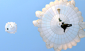 Paratroopers descend to the ground during training exercise