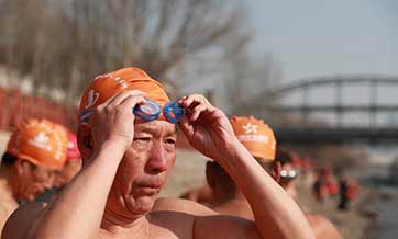 China's Lanzhou holds winter swimming event in Yellow River