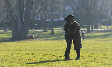 People enjoy sunshine at park in Frankfurt, Germany