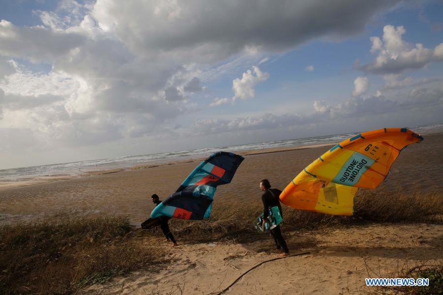 Israeli kite surfers practice on Mediterranean beach