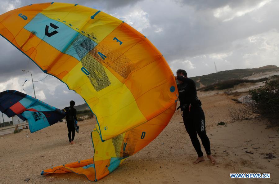 Israeli kite surfers practice on Mediterranean beach