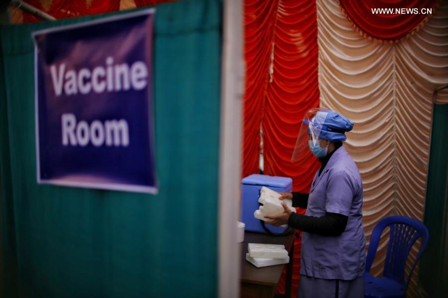 Medical workers work at vaccination room in Kathmandu, Nepal