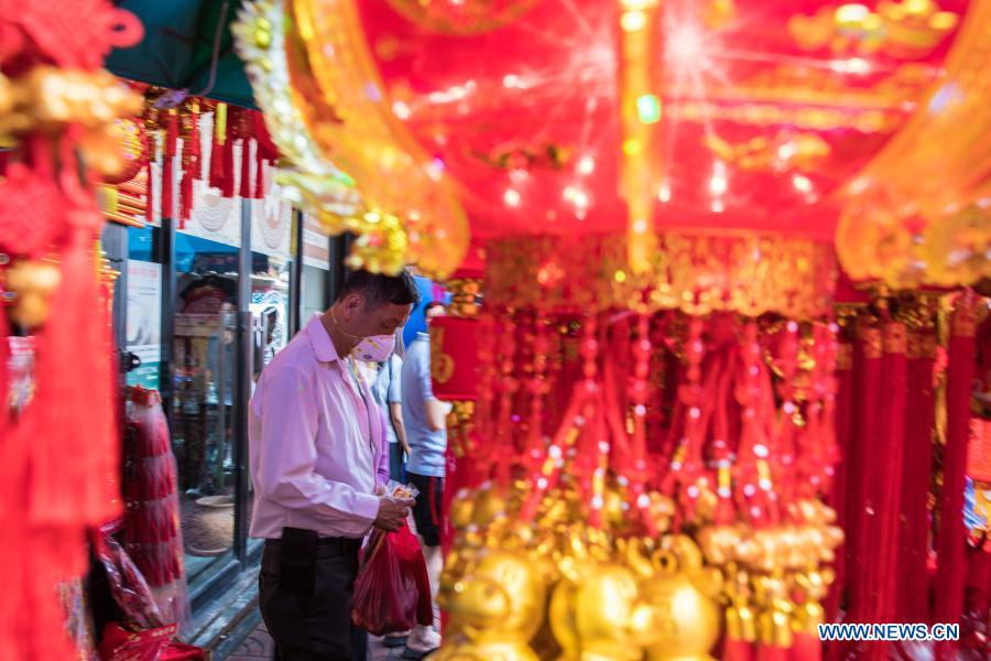 People buy spring couplets and other decorations for upcoming Chinese Lunar New Year in Bangkok