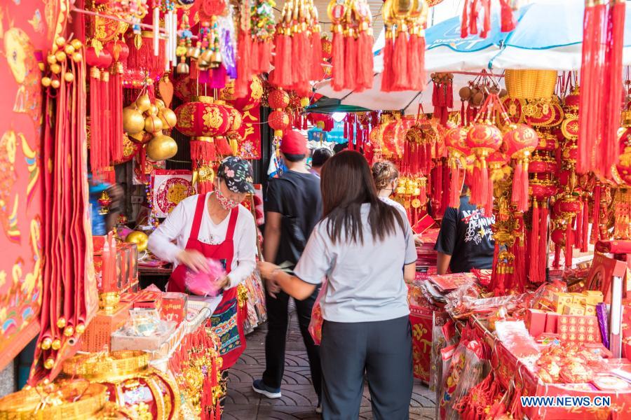 People buy spring couplets and other decorations for upcoming Chinese Lunar New Year in Bangkok