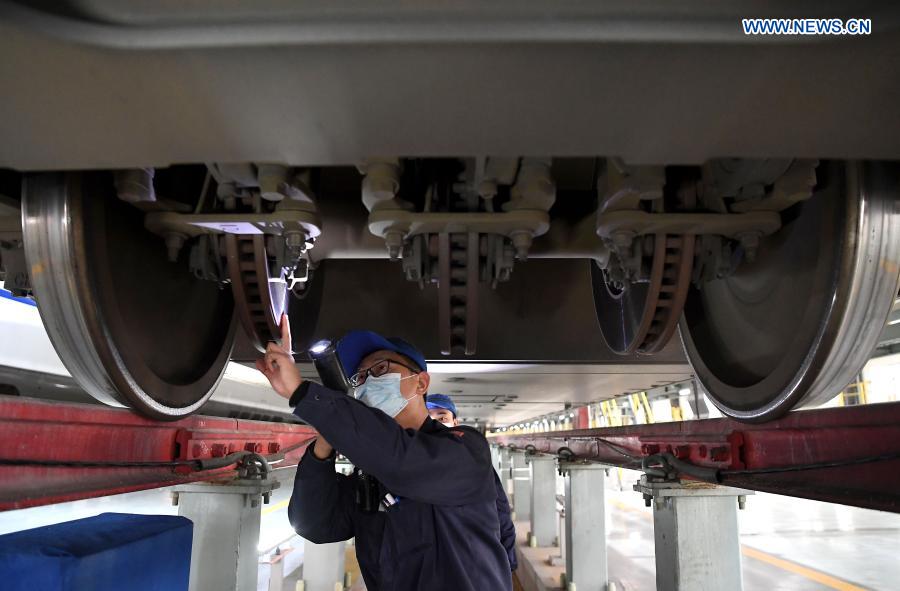 Workers carry out maintenance work, epidemic precaution for trains in preparation for Spring Festival travel rush