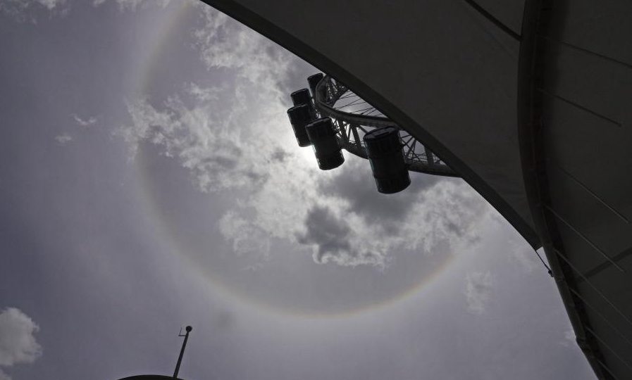 Sun halo appears in sky above the Singapore Flyer