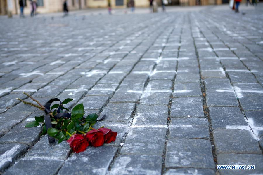 Old Town Square painted with white crosses in memory of victims of COVID-19 pandemic in Prague