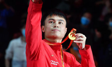 Underdog Zhou ends China's table tennis simulation in heroic fashion