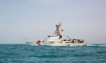 U.S. ship fires warning shots in encounter with Iranian vessels in Strait of Hormuz
