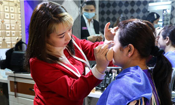Young female beautician, hairdresser runs booming business in Xinjiang's Hotan