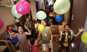 Members of Egyptian family celebrate Eid al-Fitr at home amid COVID-19 pandemic
