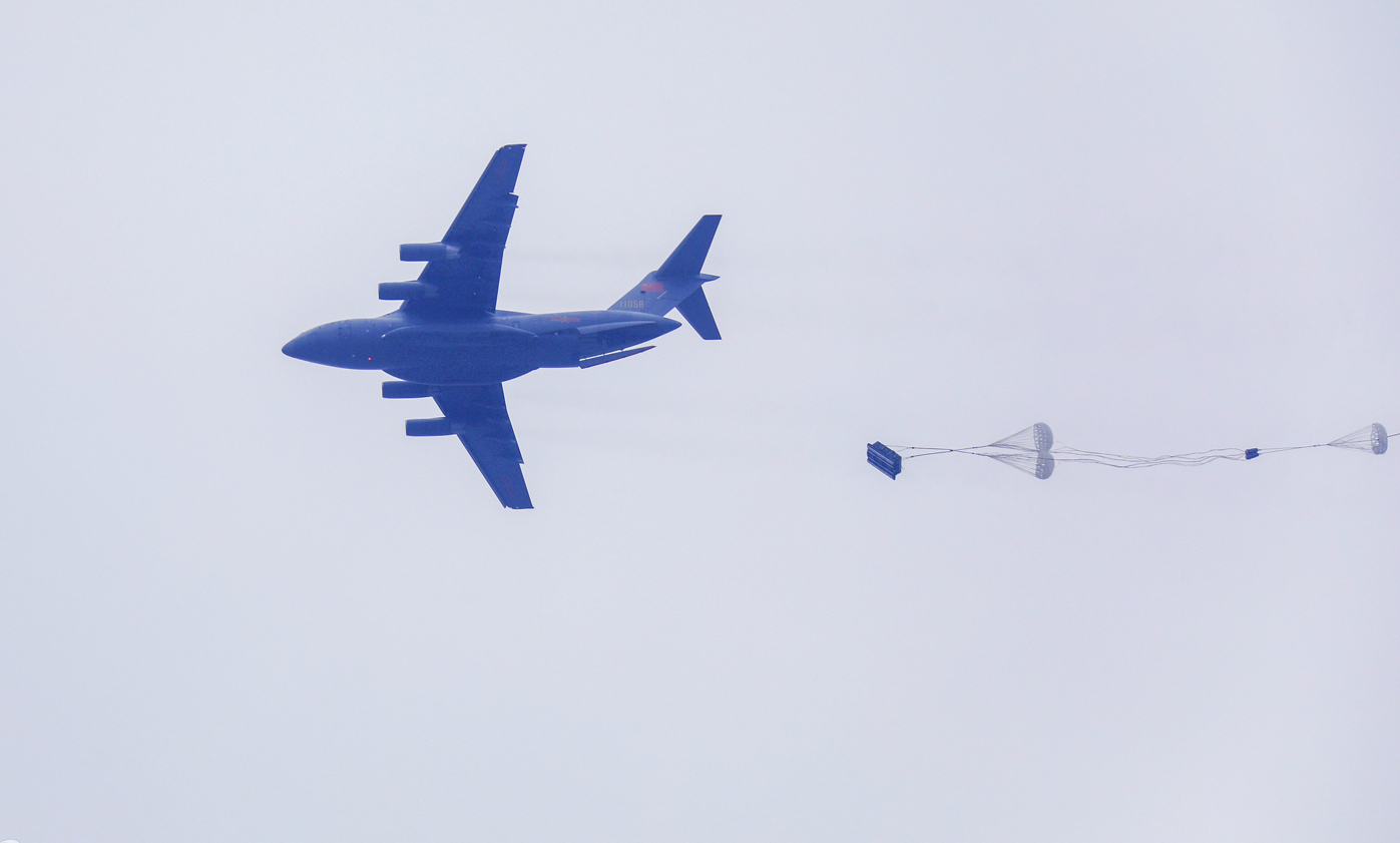 Airborne troops in heavy equipment airdrop training